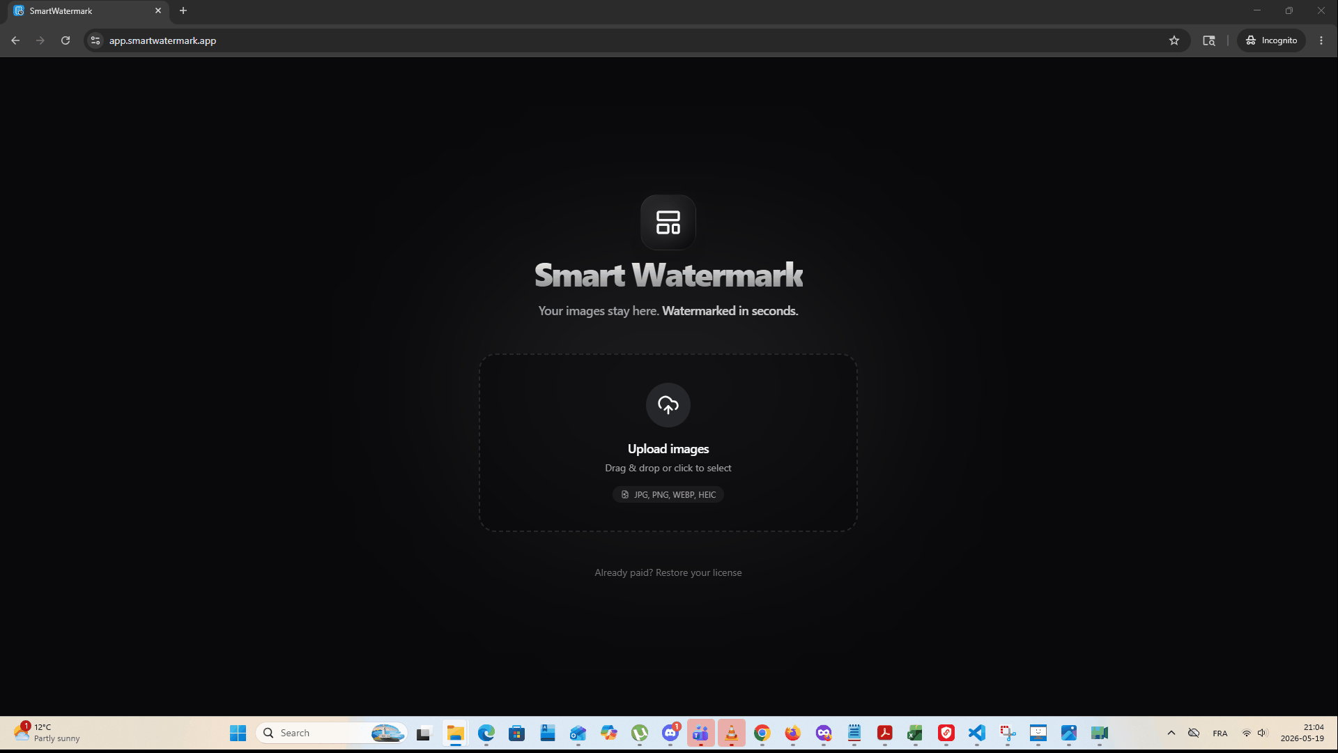 SmartWatermark in action — drag and drop photos, apply watermark, download ZIP
